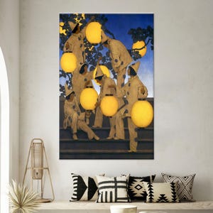 May include: A framed art print depicts figures in white costumes with yellow lanterns, set against a blue sky and tree branches. The artwork features a group of people on steps, holding and interacting with the glowing orbs.