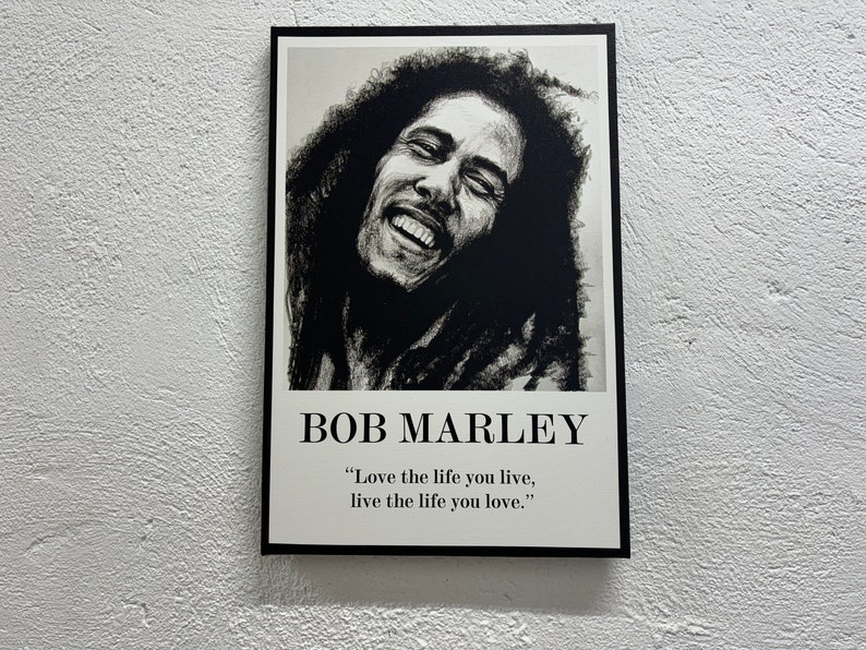 May include: Black and white portrait of Bob Marley with the quote "Love the life you live, live the life you love."