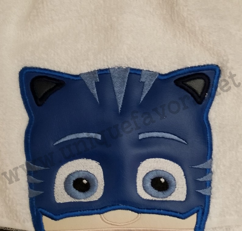 Masks inspired characters with optional personalization. Hooded towels or other items available. 3 characters to choose from image 2