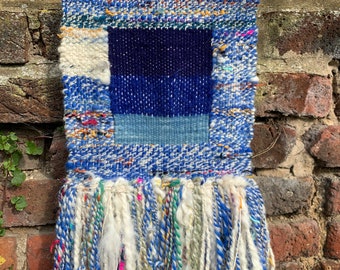 Sea Blues handwoven wall hanging with hand-spun waste art yarn and reclaimed wool