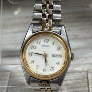 SEIKO 7N83-0011 Calendar 2 Tone Gold Silver Band & Black Gold Quartz Cuff Bangle Bracelet Watch UNTESTED