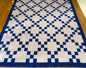 This classic Irish chain quilt measures 85" X 94"  Colbalt blue and light lilac quilt