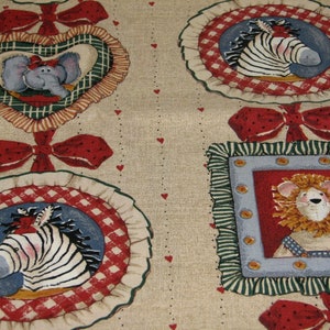 May include: Beige fabric with a repeating pattern of red bows, red and white gingham, and framed illustrations of animals. The animals include a zebra, an elephant, and a lion.