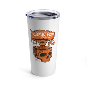 May include: White stainless steel tumbler with a graphic of a skull with an orange explosion coming out of the top of its head. The text "ATOMIC POP TRADING CO." is above the skull.