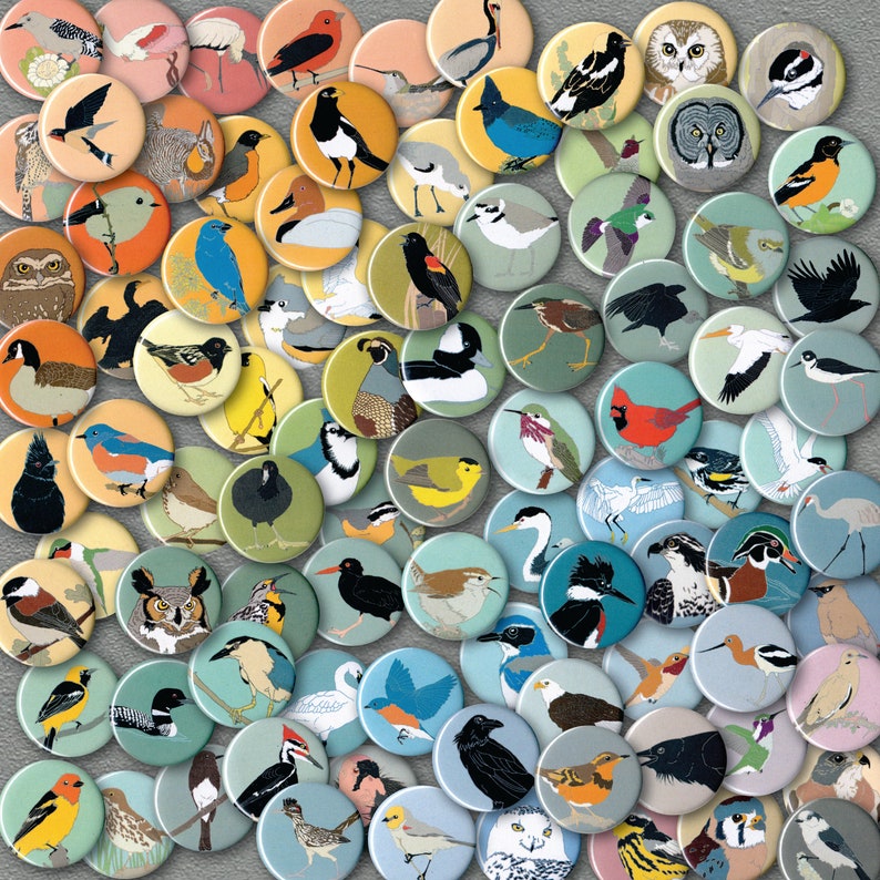 May include: A collection of colorful, round buttons featuring various animal and nature-themed designs. The buttons are arranged in a circular pattern, creating a visually appealing and diverse display.