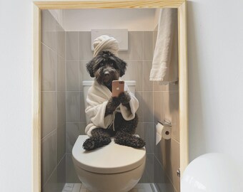 May include: A black dog wearing a white bathrobe and a white towel on its head is sitting on a white toilet in a bathroom. The dog is holding a pink smartphone in its paws.