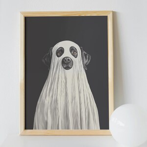 May include: A framed illustration of a black dog wearing a white ghost costume on a dark gray background.