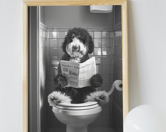 May include: A black and white photograph of a dog sitting on a toilet and reading a newspaper. The newspaper headline reads "Agobry bske-San Doy".