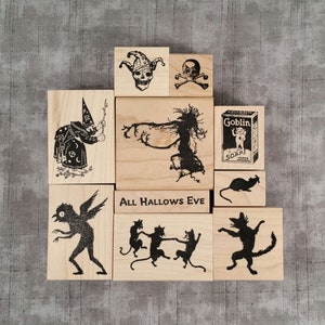 Wood mount rubber stamps
1. Skull with Jester Hat
2. Skull & Cross Bones #2
3. Goblin Soap Box
4. Rat Silhouette
5. Dancing Cat Silhouette
6. 3 Dancing Cats Silhouette
7. Owl Bogeyman
8. Witch w Twig Wand
9. Witch Tree Silhouette
10. All Hallows Eve