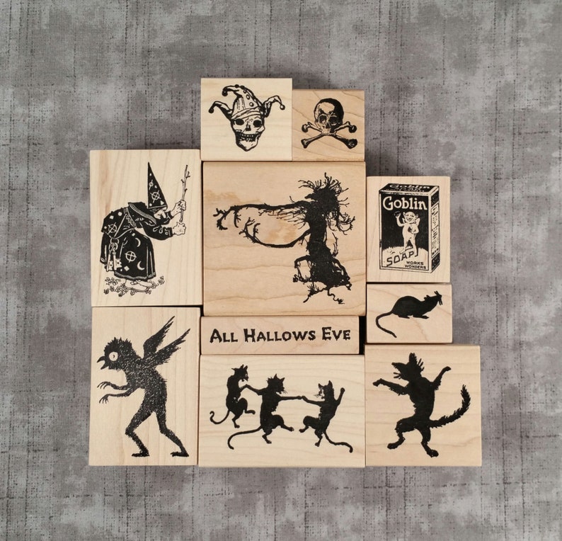 Wood mount rubber stamps
1. Skull with Jester Hat
2. Skull & Cross Bones #2
3. Goblin Soap Box
4. Rat Silhouette
5. Dancing Cat Silhouette
6. 3 Dancing Cats Silhouette
7. Owl Bogeyman
8. Witch w Twig Wand
9. Witch Tree Silhouette
10. All Hallows Eve