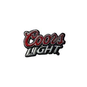 May include: Embroidered patch featuring the "Coors Light" logo in red and white lettering with a black border. The patch is a rectangular shape and is likely designed to be sewn or ironed onto fabric.