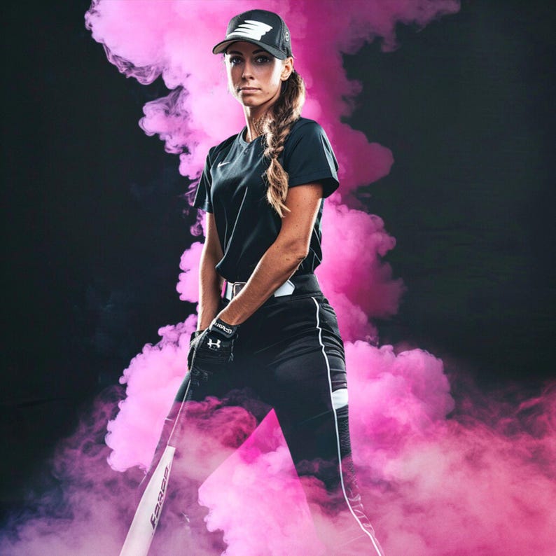 May include: A woman wearing a black baseball cap, black shirt, and black pants with white stripes stands in front of a pink smoke background. She is holding a baseball bat.