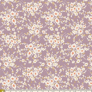 May include: A purple fabric with a white and orange floral pattern. The fabric is shown with a ruler for scale.