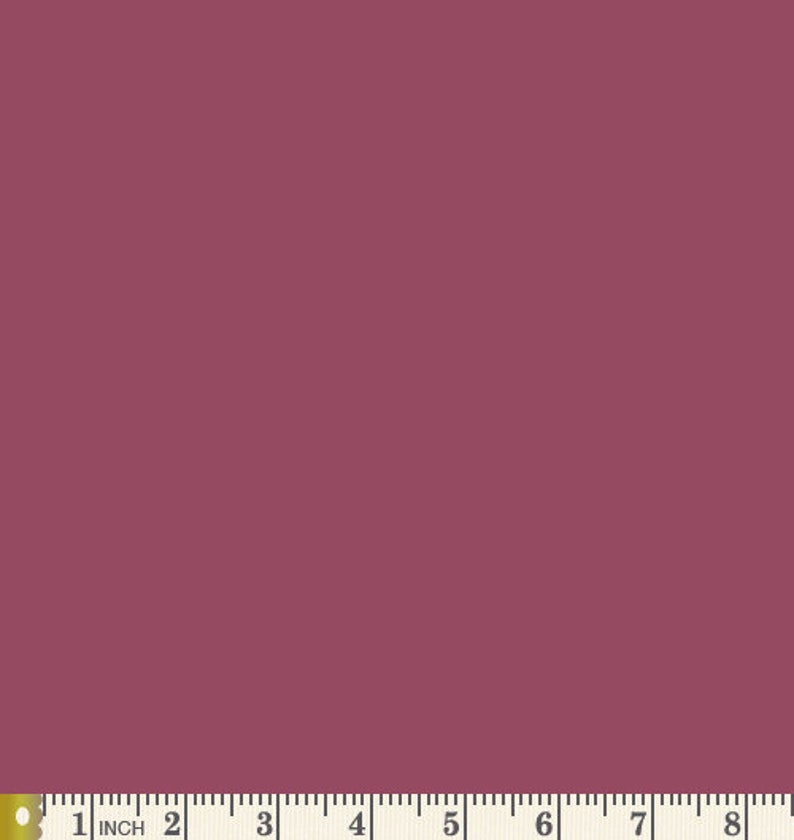 May include: A solid, deep red fabric swatch. The fabric is smooth and appears to be a woven material.