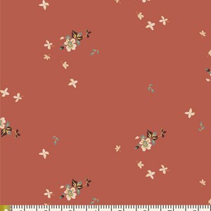 May include: A red fabric with a white floral pattern. The flowers are small and delicate, with a few larger flowers scattered throughout. The fabric has a subtle texture.