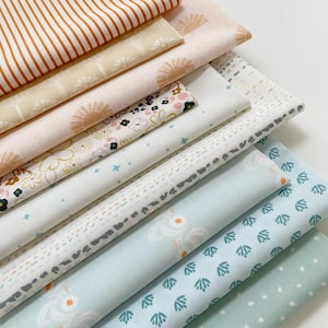 May include: A stack of eight fabric squares with various patterns in shades of orange, pink, white, blue, and green. The patterns include stripes, floral designs, and geometric shapes.