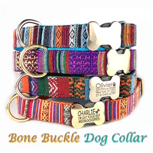 May include: Four colorful dog collars with bone-shaped buckles. The collars are stacked on top of each other. The top collar is turquoise blue with a gold bone buckle. The second collar is purple with a gold bone buckle. The third collar is green and orange with a silver bone buckle with the text "Olivier 234 Prince Street New York, NY 10012 212-345-6789". The bottom collar is orange and red with a silver bone buckle with the text "CHARLIE I'M LOST. PLEASE HELP! MICROCHIPPED".