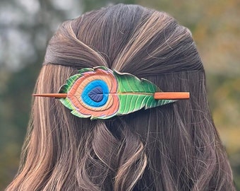 Hand painted and tooled leather peacock feather hair stick barrette. Shimmering leather hair slide with copper accents and amber wood stick.