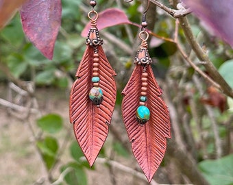 Copper leaf leather earrings with Kingman turquoise and African turquoise beads. Wire wrapped earrings with antique copper hooks.