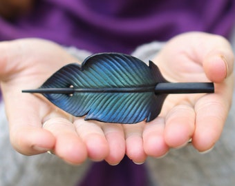 Raven feather ponytail holder with wood stick. Small tooled leather shawl pin in black w/ iridescent blues and greens. Gift for corvid lover