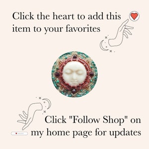 May include: A round, beaded pendant featuring a serene face with closed eyes. The pendant is surrounded by red, green, and gold beads. The image includes text that says, "Click the heart to add this item to your favorites" and "Click 'Follow Shop' on my home page for updates."