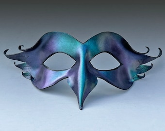 Color shifting leather bird mask for adult Halloween costume or masquerade ball. Unseelie faerie mask in iridescent green blue & purple.