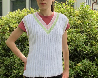 Tunic Tennis Vest, twisted stitches replace traditional cables in this sweater vest. PDF knitting pattern