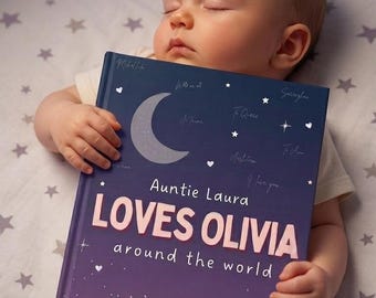 May include: A sleeping baby holds a personalized book titled "Auntie Laura Loves Olivia around the world." The book has a dark blue cover with a crescent moon, stars, and a large illustration of the Earth.