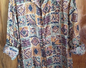 Vintage silk blouse women size medium multi-color pattern long sleeves in very good gently used condition with no apparent imperfections