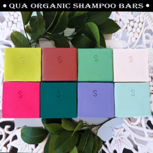 May include: Eight colorful shampoo bars arranged in two rows of four. The bars are all the same size and shape, and they are all labeled with the letter "S".