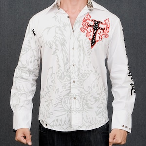 May include: White long-sleeve button-down shirt with a gray and white print of a crown and a cross with flames. The shirt has black accents and a black and white patterned collar.