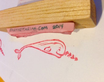 Narwhal rubber stamp mounted on wood