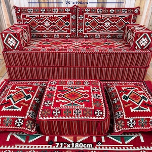 May include: A red and white patterned sofa set with matching cushions and a rug. The sofa measures 75 inches by 190 cm, and the rug is 71 inches by 180 cm. The cushions are 16 inches by 40 cm and 8 inches by 20 cm.