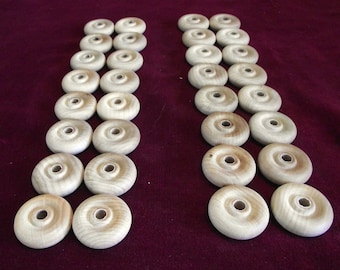 32  Wheels  1-1/4 inch diameter with 1/4 hole  Unfinished Hardwood