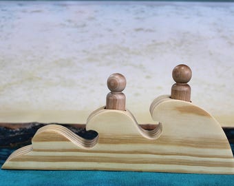 Riding the Waves with Peg Dolls