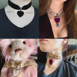 May include: A collection of chokers featuring heart-shaped pendants. One choker is black velvet with a black heart, another has a purple heart pendant with turquoise beads, and two others have heart pendants with floral and lace details.