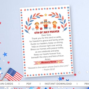 May include: A rectangular card featuring a 4th of July prayer with watercolor illustrations of three children, red and blue leaves, and a border of red and blue stars. The text includes the title 4TH OF JULY PRAYER and a Psalm 33:12 memory verse.