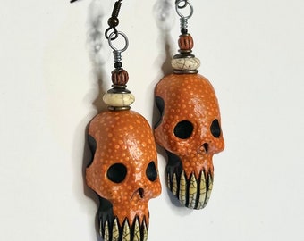 Pendientes de cabeza de zombie con calavera de sol azteca