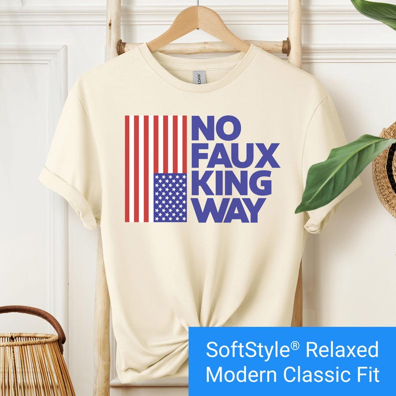 Cream color t-shirt with an inverted "in distress" American flag hanging vertically next to large text reading "No Faux King Way."