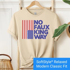 Sand color t-shirt with an inverted "in distress" American flag hanging vertically next to large text reading "No Faux King Way."
