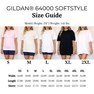 May include: A size guide for Gildan 64000 Softstyle t-shirts. The guide includes measurements for width, length, and sleeve length in inches for sizes XS to 5XL. The model is 5'8" and weighs 145 lbs. The image shows the t-shirts in various colours.