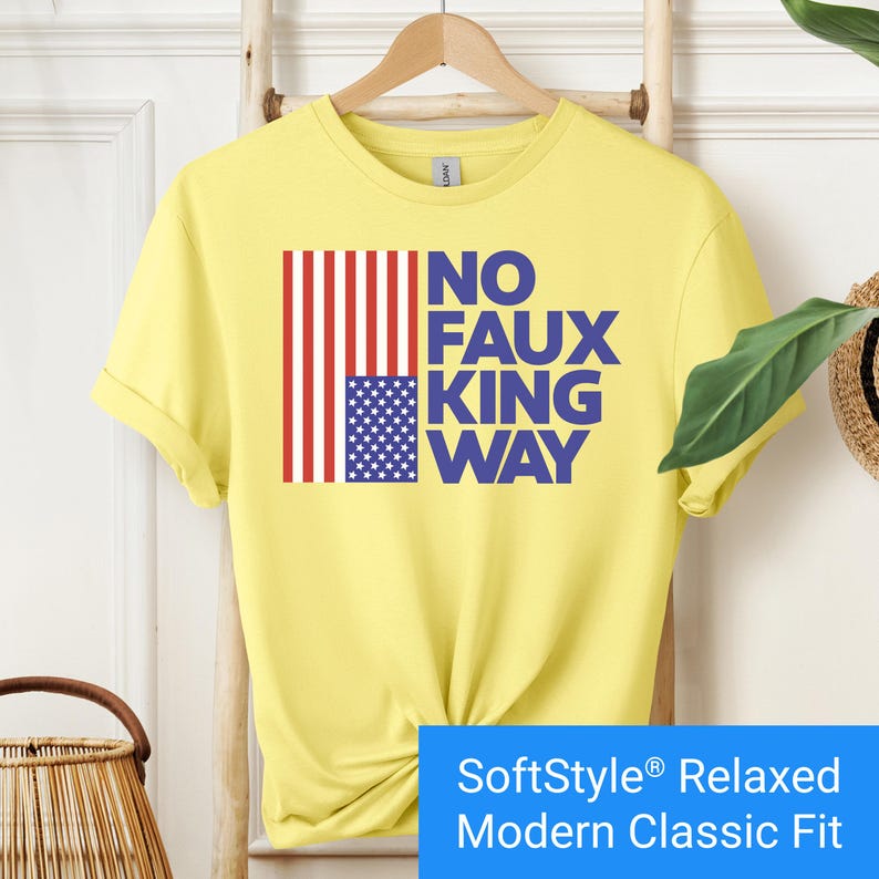 Bright yellow t-shirt with an inverted "in distress" American flag hanging vertically next to large text reading "No Faux King Way."