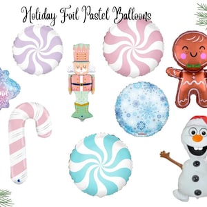 May include: Holiday foil pastel balloons in various shapes, including a snowflake, candy cane, nutcracker, gingerbread man, and snowman. The balloons feature pastel colors like pink, blue, and purple, with the text "Winter Wonderland".