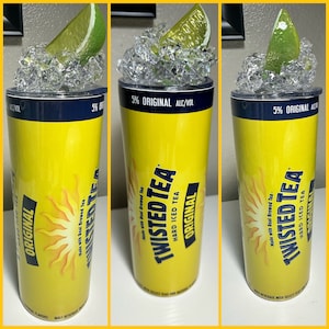 May include: A yellow and blue stainless steel tumbler with a lime wedge and ice on top. The tumbler has the Twisted Tea logo and the text "Original Hard Iced Tea" and "Made with Real Brewed Tea".