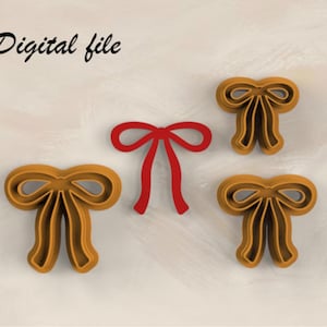 Op de afbeelding: Afbeelding van een digitaal bestand met een strikthema. De afbeelding bevat drie bruine strikvormige objecten en één rode strik. De tekst "Digital file" is in zwarte cursieve letters linksboven in de afbeelding geschreven.