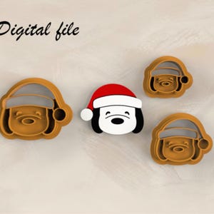 May include: Three cookie cutters in the shape of a dog wearing a Santa hat. The cutters are brown and white and are made of plastic.