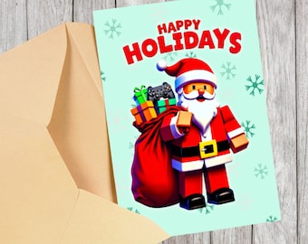 May include: A Christmas card with a cartoon Santa Claus holding a red sack filled with gifts and a video game controller. The card has the words "HAPPY HOLIDAYS" in red letters on a light blue background with snowflakes. An envelope is next to the card.