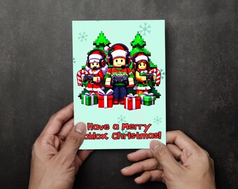 May include: A Christmas card featuring pixelated characters in festive attire, holding game controllers. The card has a light green background with snowflakes and Christmas trees. The text "Have a Merry Roblox Christmas!" is displayed.