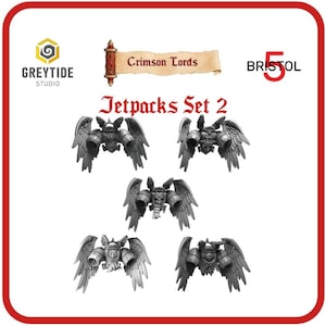 May include: Five grey miniature jetpacks with wing-like structures, arranged on a white background. The text "Jetpacks Set 2" is displayed above the jetpacks. The image also includes the text "Crimson Lords" and "Bristol 5". The logo for "Greytide Studio" is also visible.
