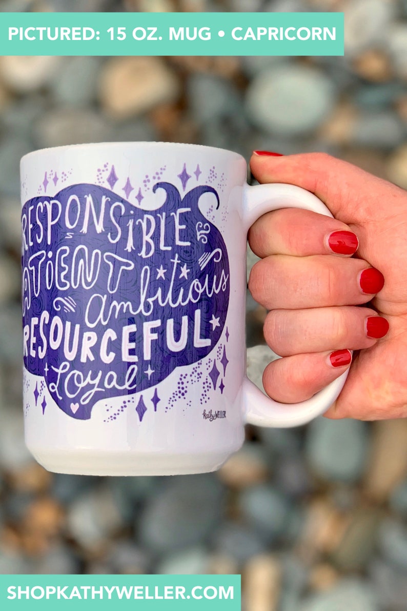 May include: White ceramic mug with a purple design that says "Responsible, Driven, Ambitious, Resourceful, Loyal" with stars and a heart. The mug is 15 ounces.